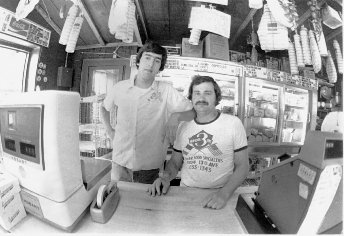 #14 Carmelo and Mike at Three Brothers Grocery, 1978.