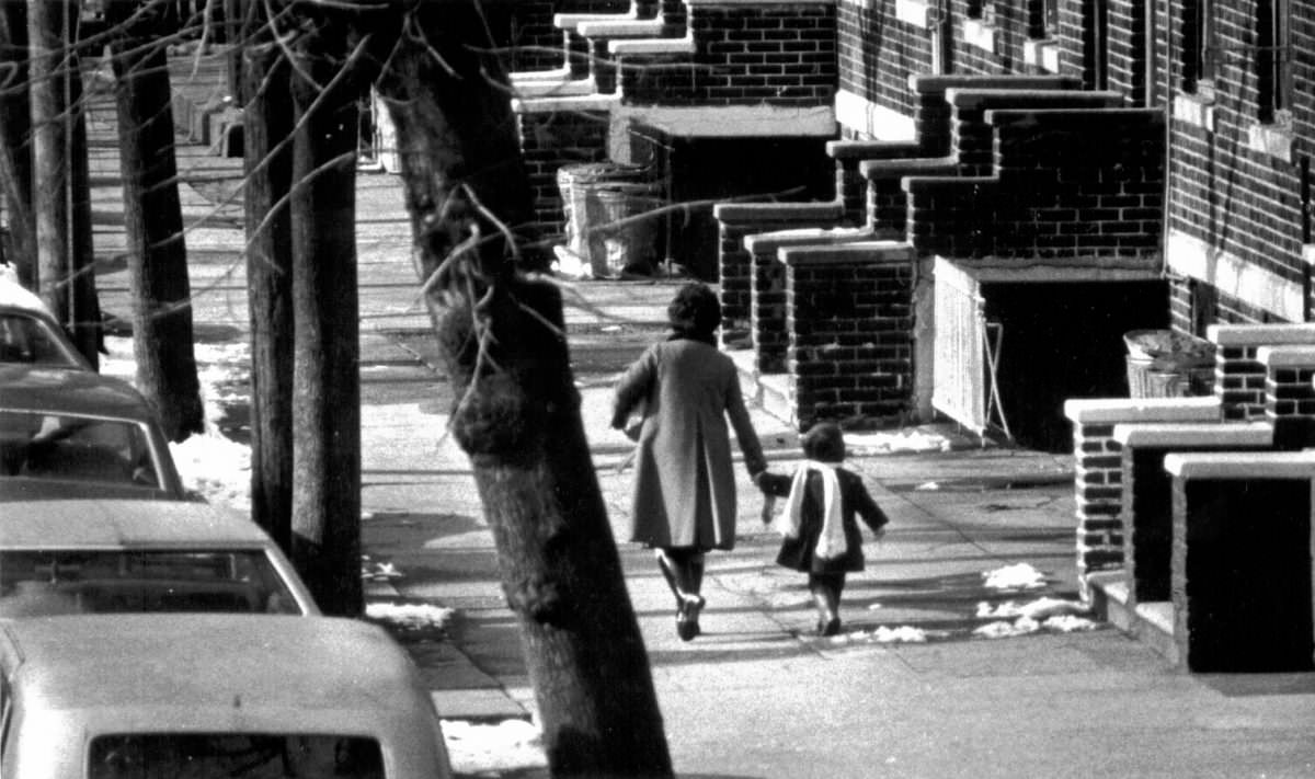 #26 Mother and daughter walking on a street in Brooklyn, 1976.