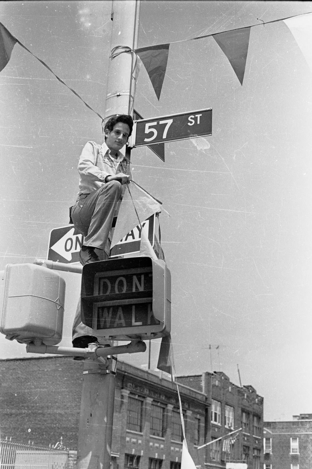 #34 Putting up block party flags in Brooklyn, 1976.
