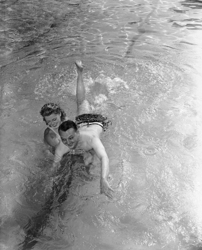 #12 Larry Allen, Associated Press war correspondent who nearly drowned when the British Cruiser Galatea was torpedoed and sunk, takes his first swimming lesson in Miami, Florida. 1942