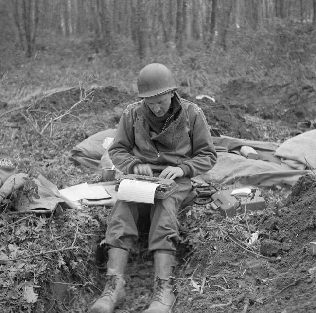 #14 Don Whitehead, Associated Press correspondent, writes his story of the landing at Anzio Beach in Italy, from a fox hole. 1944