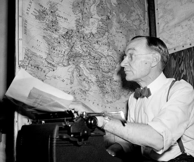 #17 Kirk Simpson, Associated Press war analyst and Pulitzer Prize winner, retires to his typewriter and his maps to study the day’s war dispatches and report for Associated Press member newspapers. 1943