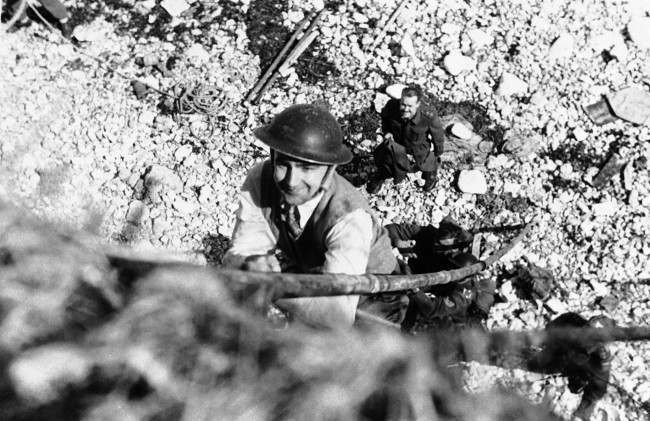#8 J. Wes Gallagher, Associated Press war correspondent in London, takes lessons in the Tommy-gun with the Canadian Army’s Commando School. 1942