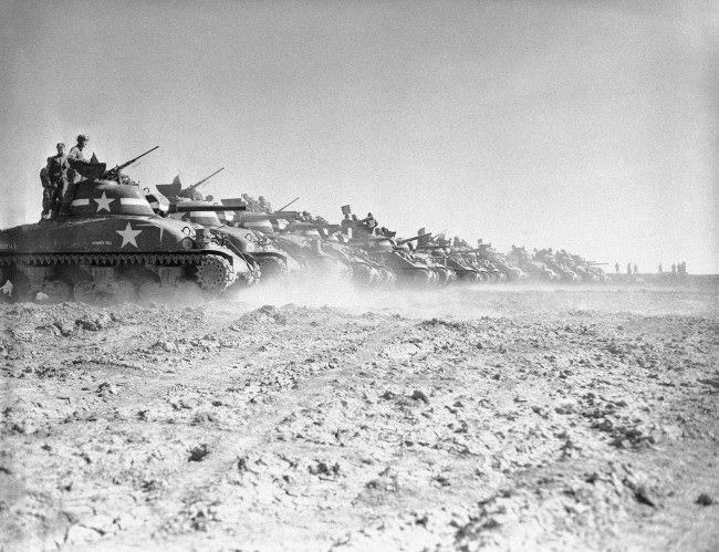 #4 Men of a U.S. tank division practice with their General Sherman tanks on a range in England, 1944.