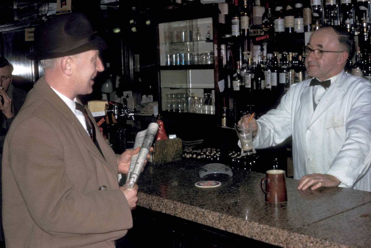 #15 Dublin, bartender and customer in Bruxelles Bar 1964