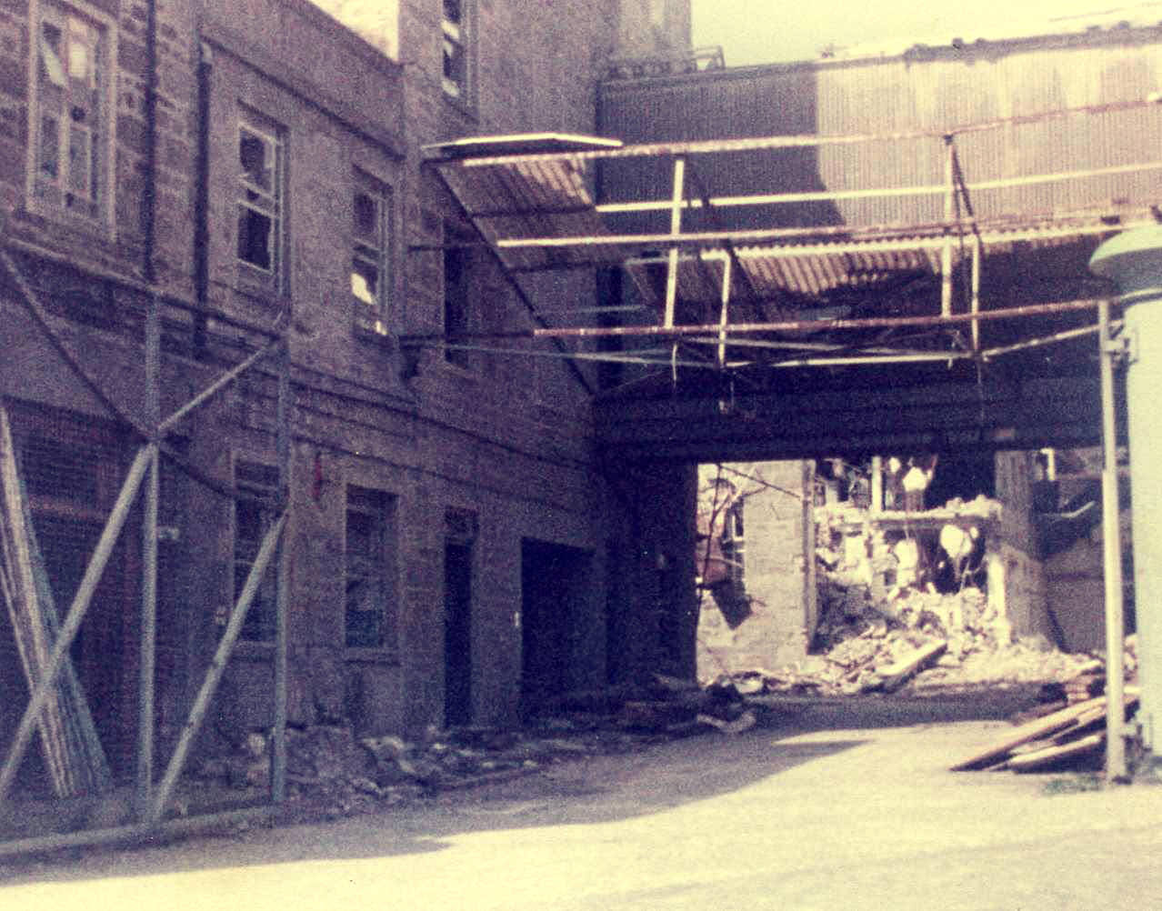 #7 Upper Dens being demolished, 1982 Demolition commences at the Crescent Street entrance to the Upper Dens jute works in 1982.
