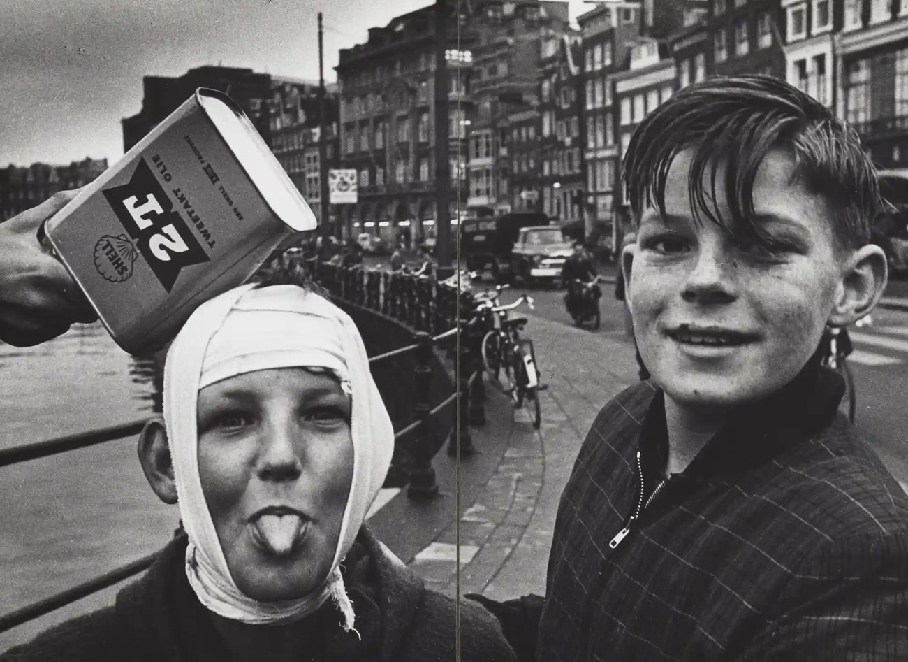 #11 Two boys pose on the street, Rokin, near the Langebrugsteeg, Amsterdam, 1950-1960