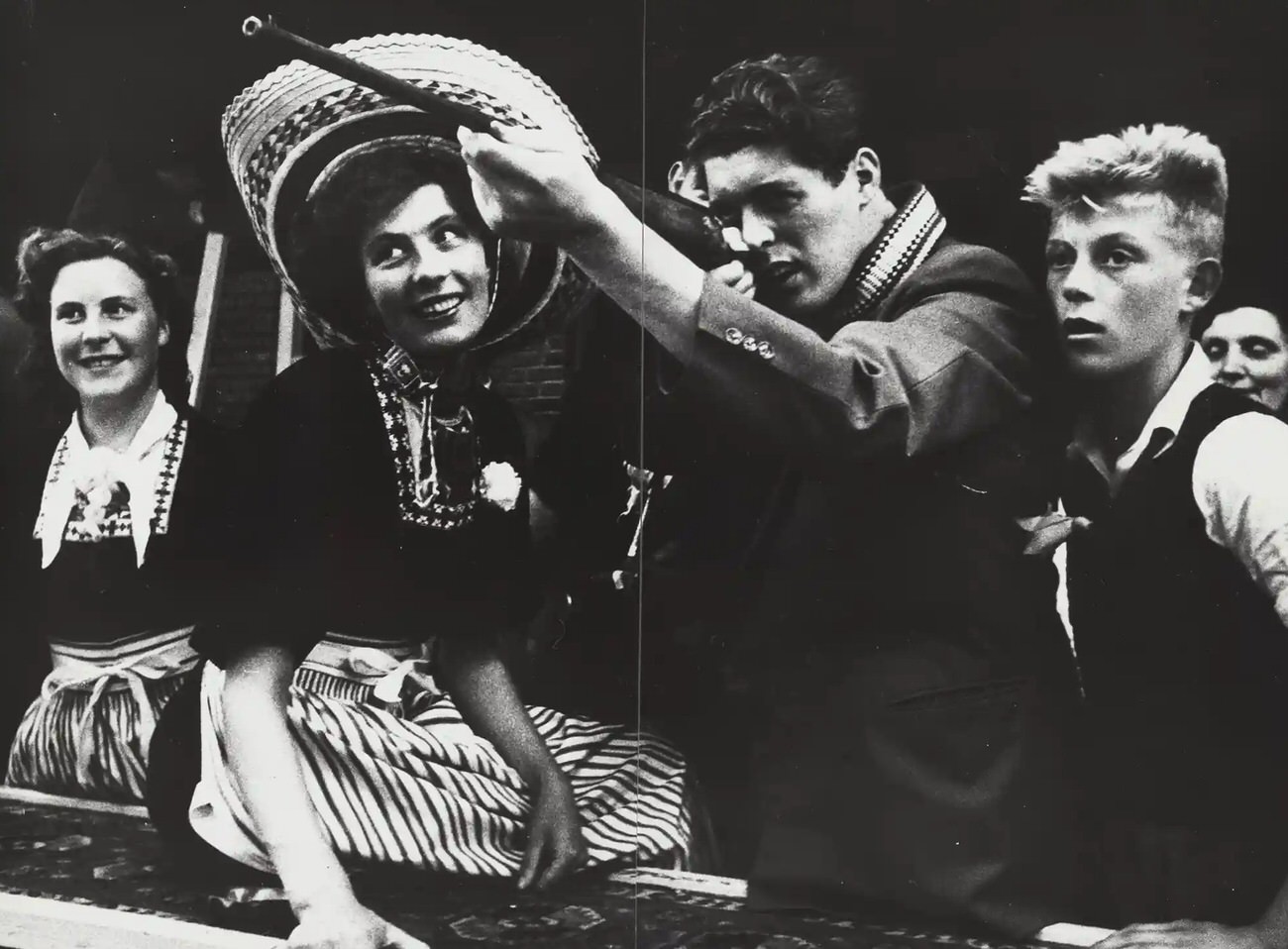 #14 Young people at a shooting gallery at the fair in Volendam circa 1955–1956