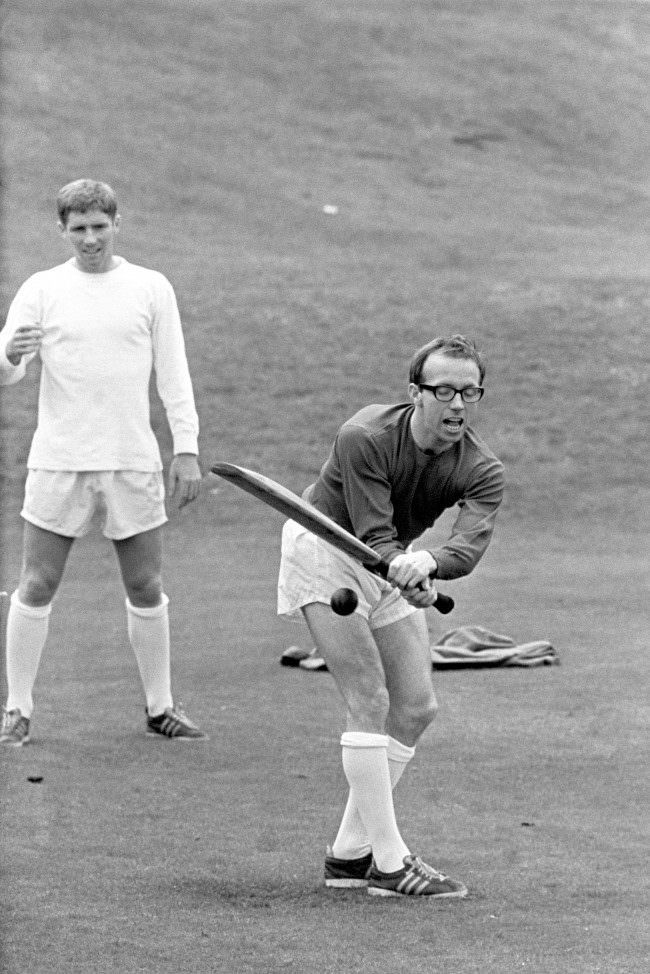 #6 Nobby Stiles playing cricket, during England’s World Cup team’s preparation at Roehampton, London, before their semi-final match against Portugal at Wembley Stadium. Fielding in the picture is Alan Ball, 1966.