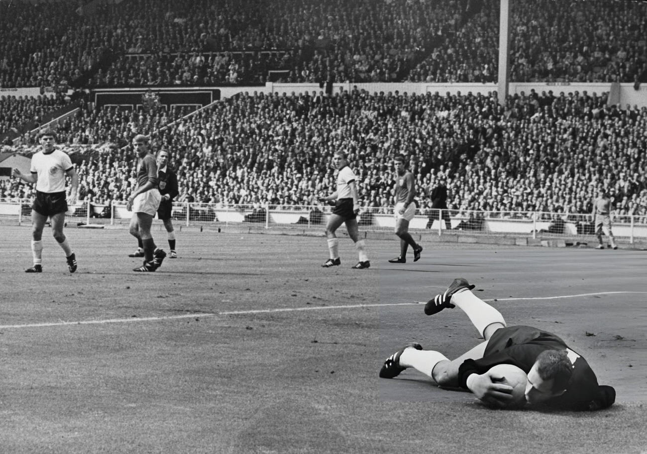#14 West German goalkeeper Hans Tilkowski saves a shot by England’s Bobby Charlton, 1966.