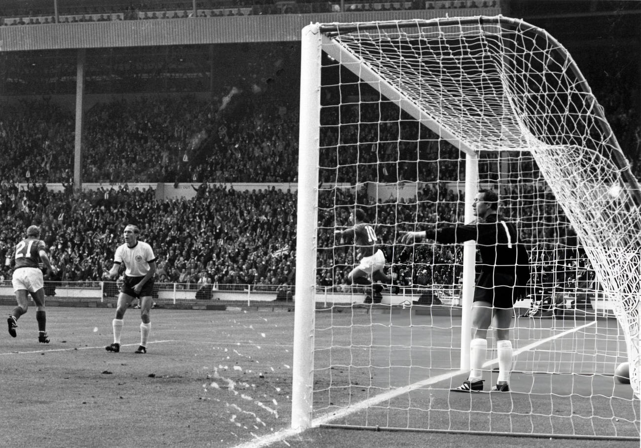 Geoff Hurst of England jumps for joy after scoring England’s first goal during their World Cup Final match, 1966.