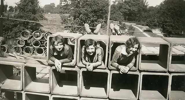 #24 Young girls have fun at a construction site.