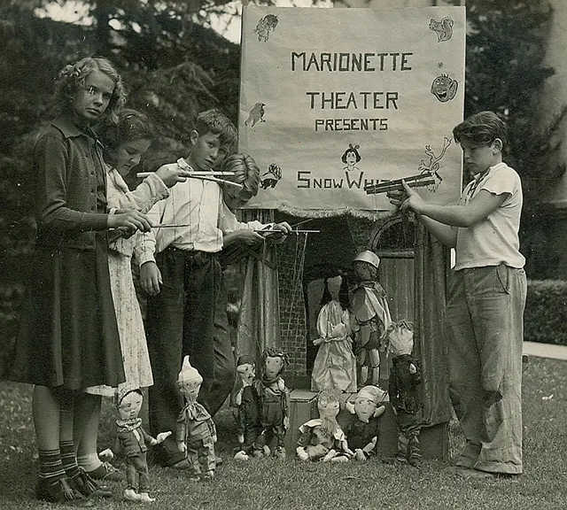 #12 Children playing with puppets.