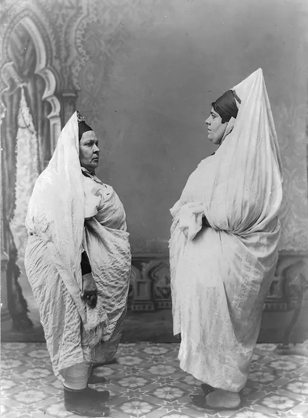 #31 Two Jewish women face each other in Tunisia, 1900s