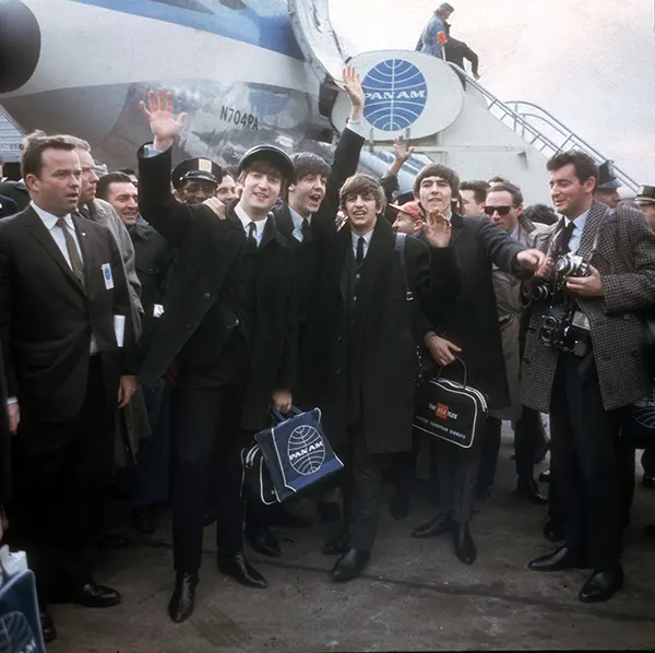 #19 The Beatles arrive in style at the JFK airport, New York, 1964.
