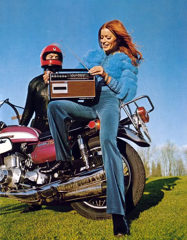 #34 A 1970s biker girl cranking up some tunes.