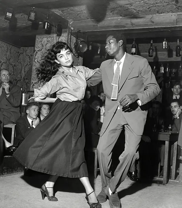 #36 A couple dancing in a 1950s “Be Bop” theater as everyone looks on.