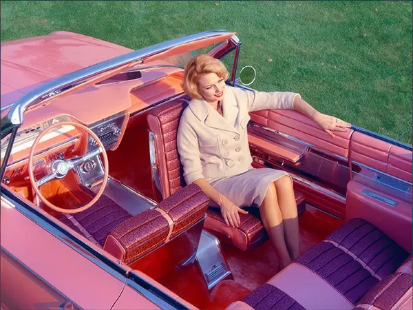 #39 A woman experiences heaven in the 1961 Buick “Flamingo” equipped with a rotating front seat.
