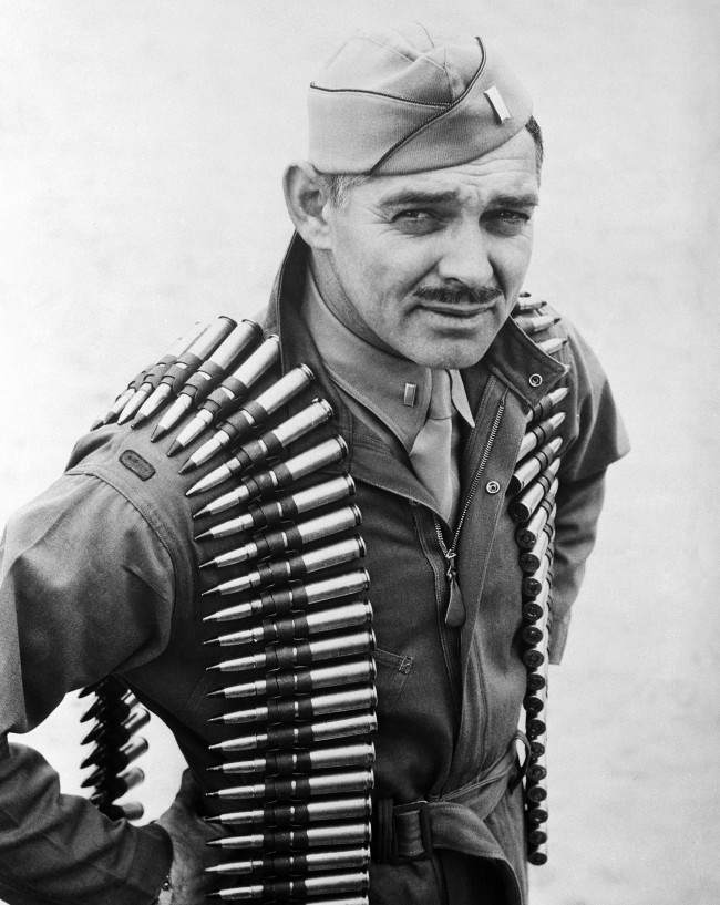 #3 First Lieut. Clark Gable, former movie actor now an aerial gunner in the Army Air Forces, wears a double shoulder sling of .50 caliber machine gun bullets in taking off on a practice firing mission at Tyndall Field in Panama City, Florida on Jan. 20, 1943.