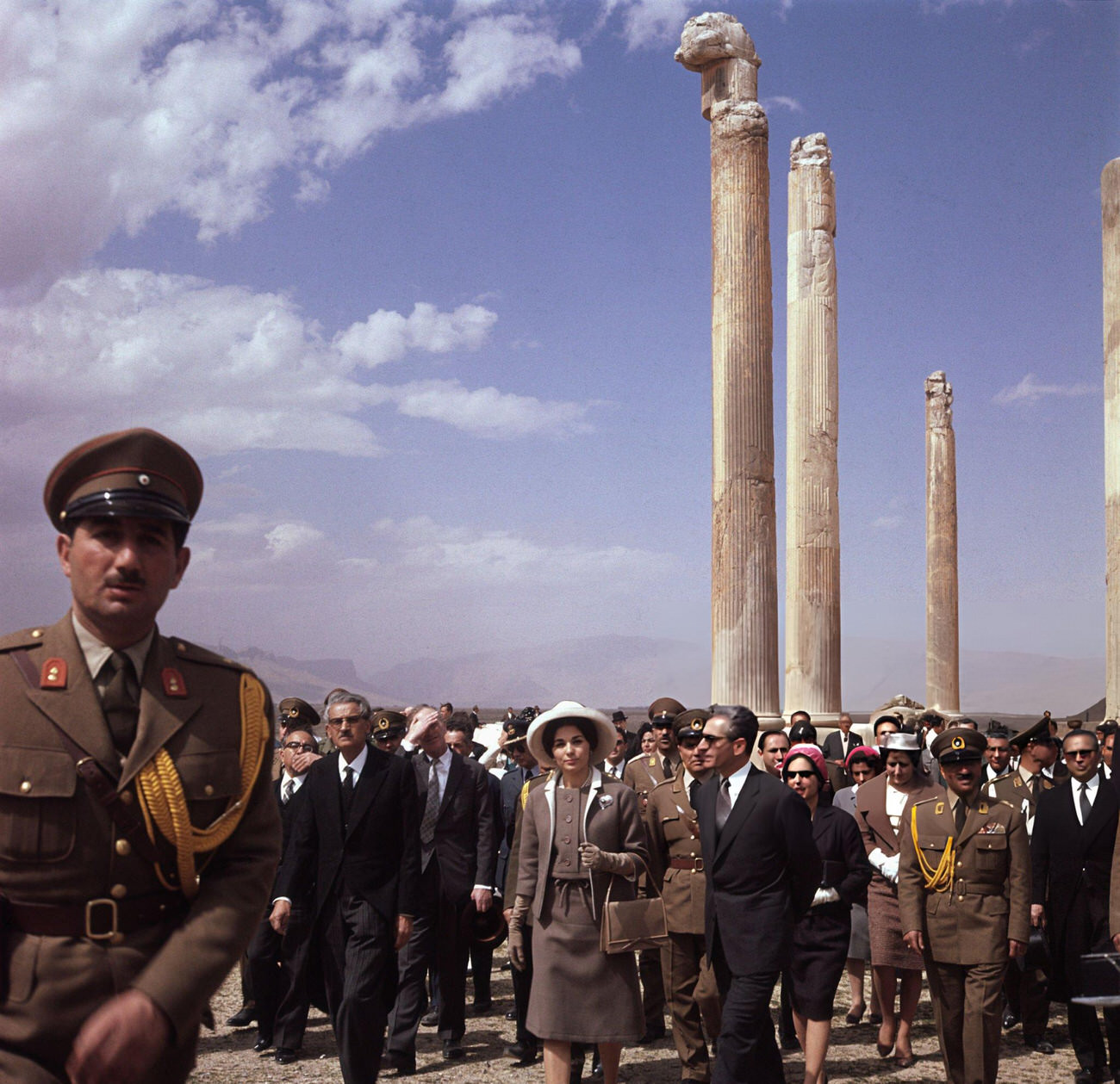 #13 The Shah of Iran and his third wife, Queen Farah, accompanied by officials, on a visit to Persepolis, the ancient capital of Persia, 1960s.