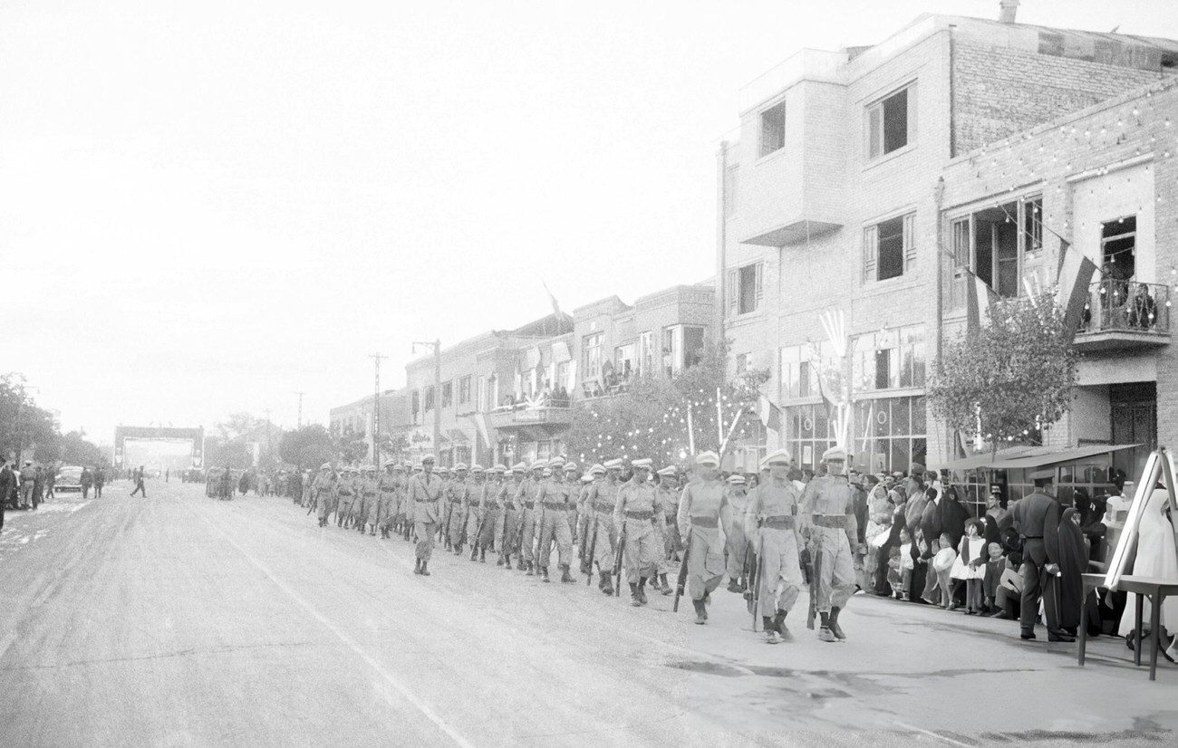 #25 A military parade in the streets of Tehran for the birth of Prince Reza Cyrus Pahlavi, Tehran, 1960.