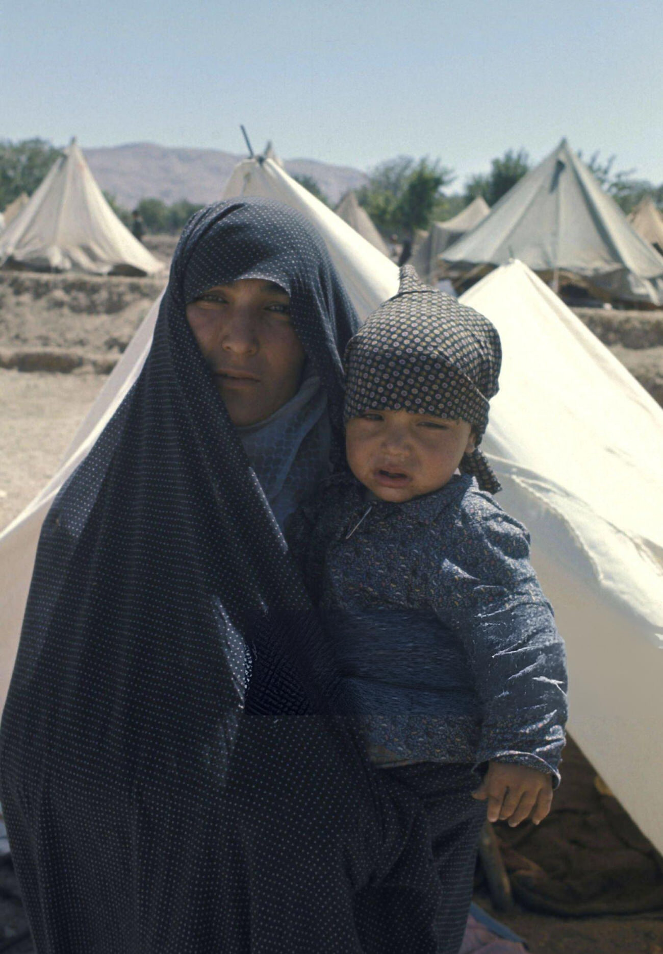 #81 Refugees in one of the camps set up by the Imperial Army and the Red Lion and Sun Society to shelter the earthquake victims in Khorasan Province, Iran, 1968.
