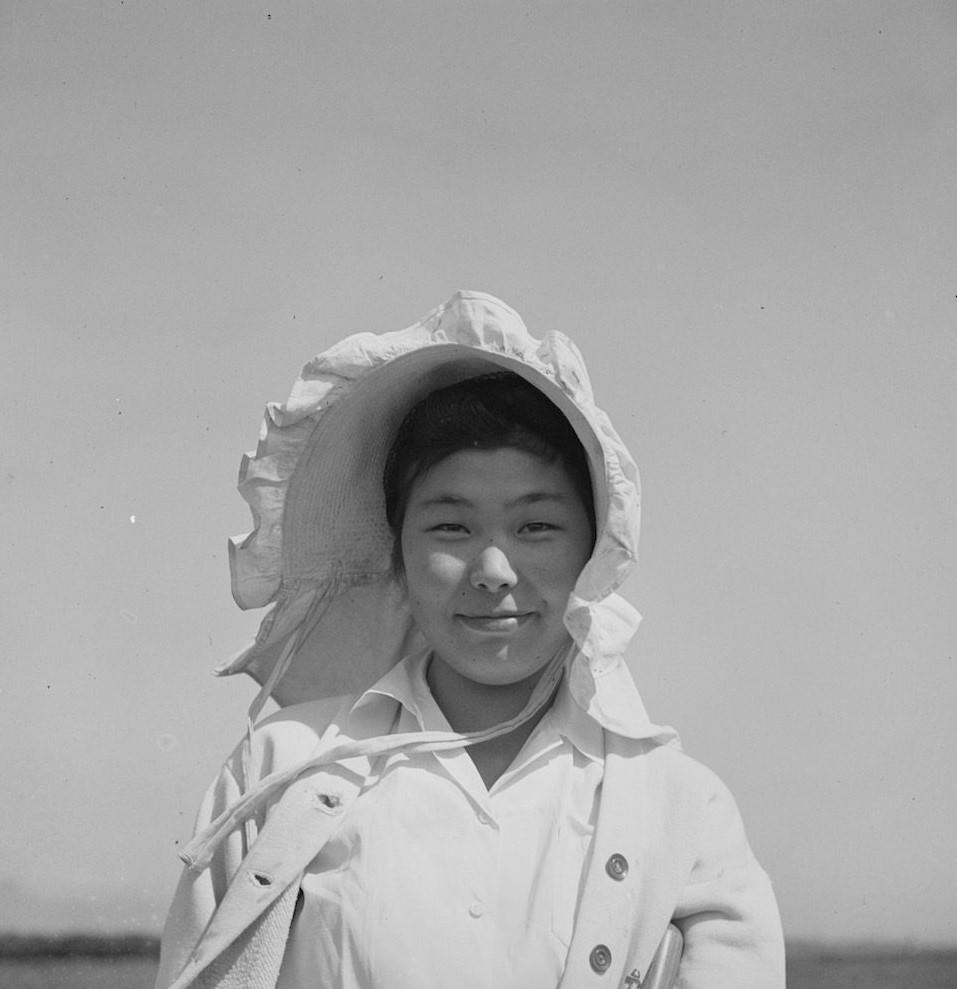 #22 San Benito County, California. Japanese-American working in a field while awaiting final evacuation orders, 1942.