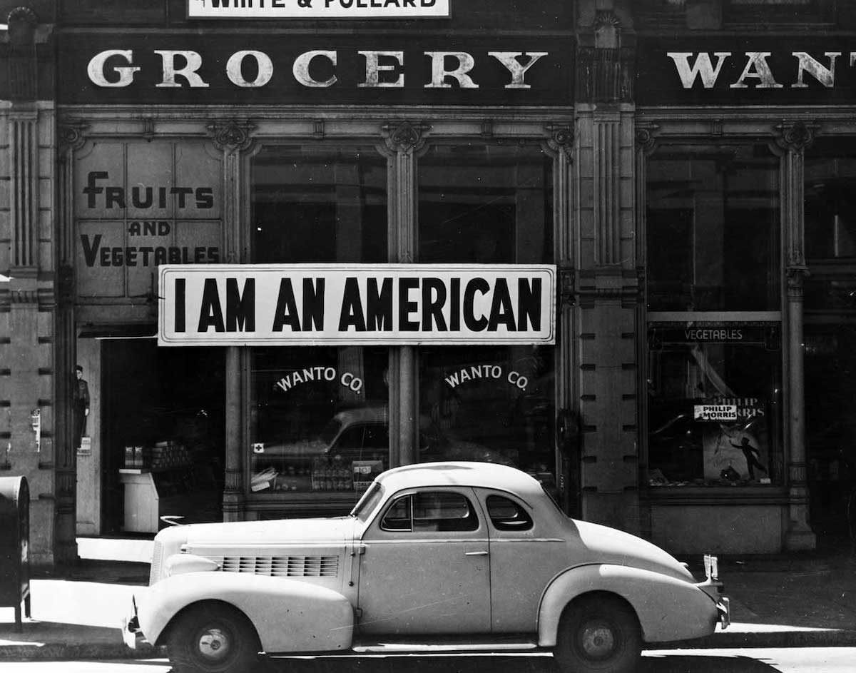 #6 A large sign reading “I am an American” placed in the window of a store, Oakland, California, 1942.