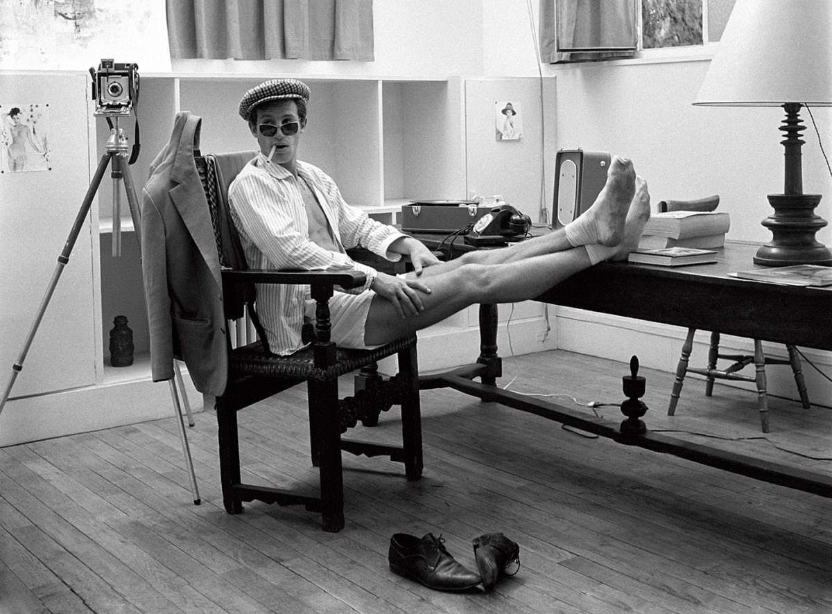 #18 Raymond Cauchetier and Jean-Paul Belmondo on the set of ‘A bout de Souffle’ directed by Jean-Luc Godard, 1960.
