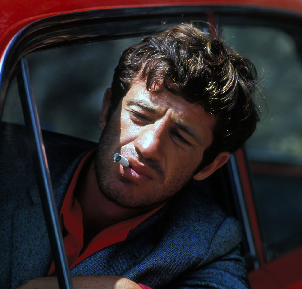 #6 Jean-Paul Belmondo in ‘Pierrot le fou’ directed by Jean-Luc Godard, 1965.