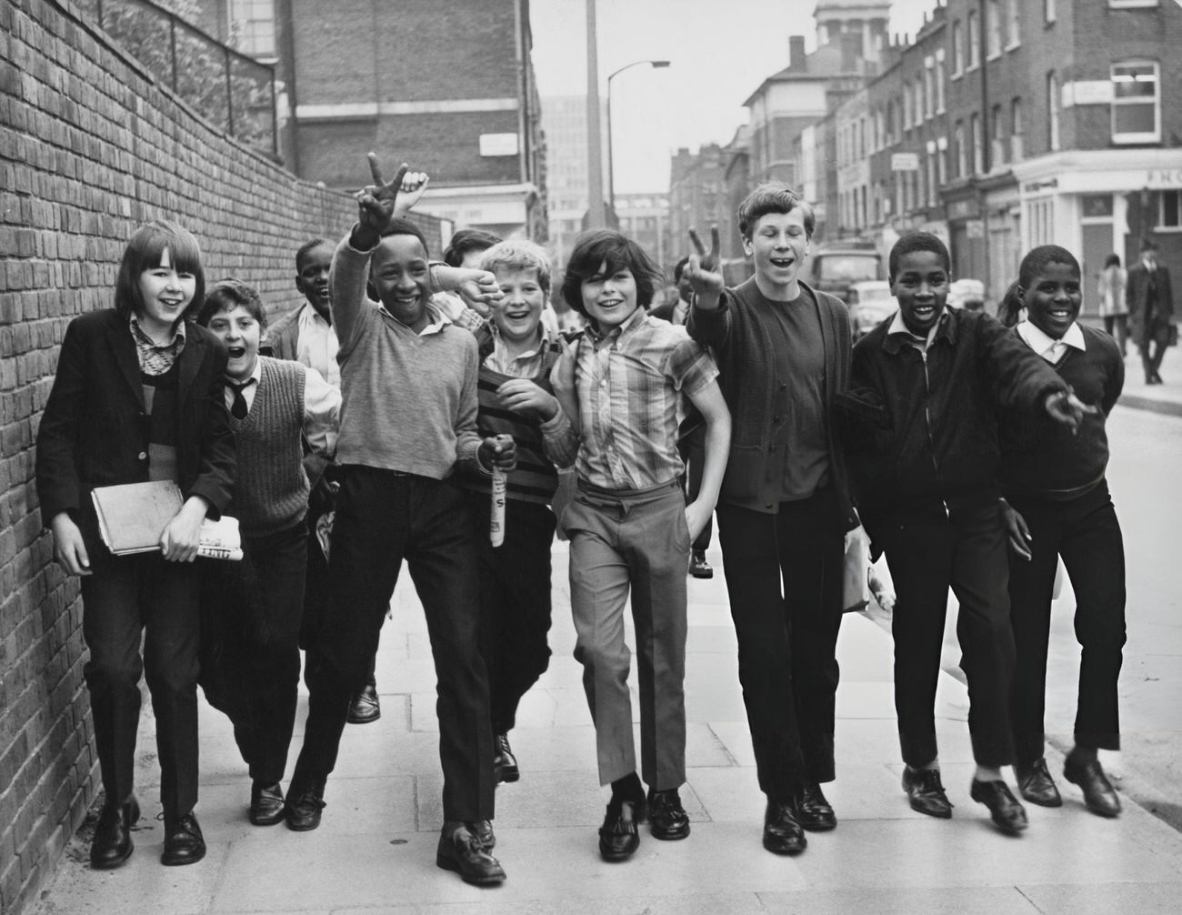 #11 Rutherford Comprehensive School pupils wearing their ordinary clothes arrive at the school in Marylebone, London, 1972.