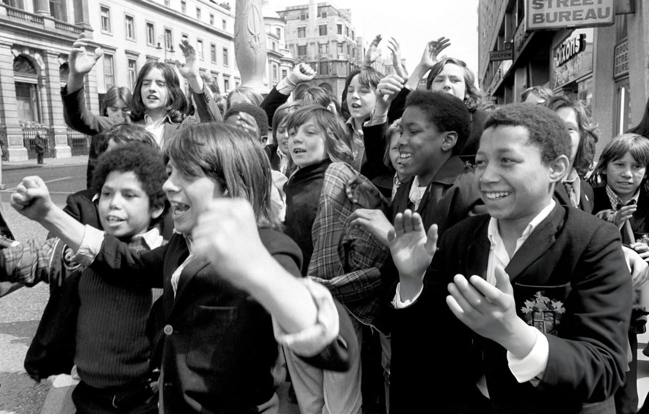 #16 London schoolchildren at Charing Cross support a strike called by the Schools Action Union, 1972.