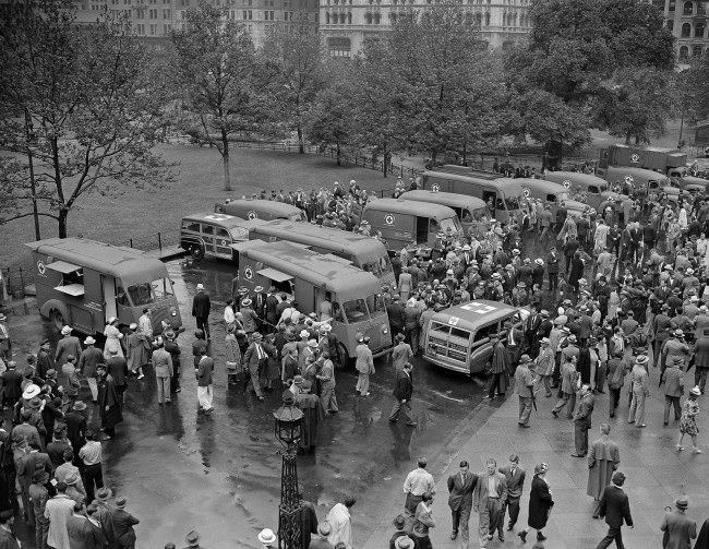#18 Crowds inspect the 14 mobile disaster units dedicated to the Red Cross in New York, June 27, 1942, by the Masons of New York state.