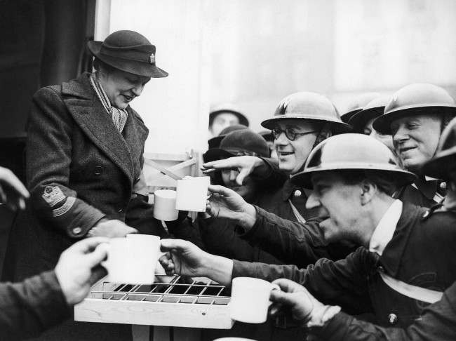 #2 Mrs. Montagu Norman, the wife of the governor of the Bank of England, handing out tea to the A.R.P. workers after she had opened the canteen at Islington Town Hall, Jan. 15, 1940.