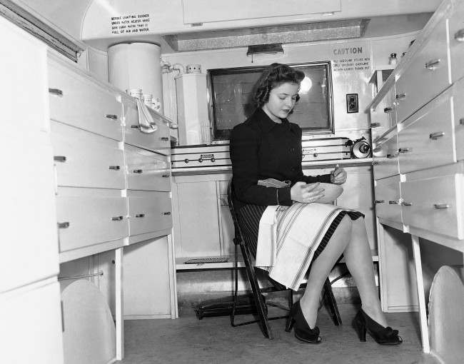 #4 A woman works in a mobile Kitchen, Feb. 15, 1941.