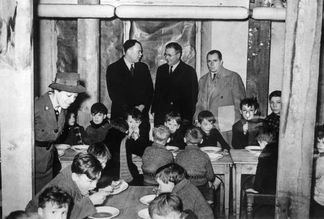 #47 The delegates visit a canteen in a Brussels school in Belgium on Jan 28, 1941. From left to right are: Mr. G. Murray, Mr. Mac Donald, and Mr. Frederic Dorsey Stephens, Head of the delegation.