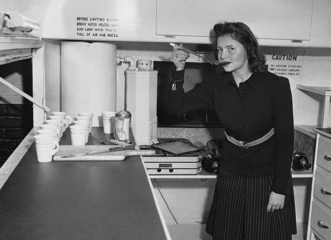 #5 A woman works in a mobile Kitchen, Feb. 15, 1941.