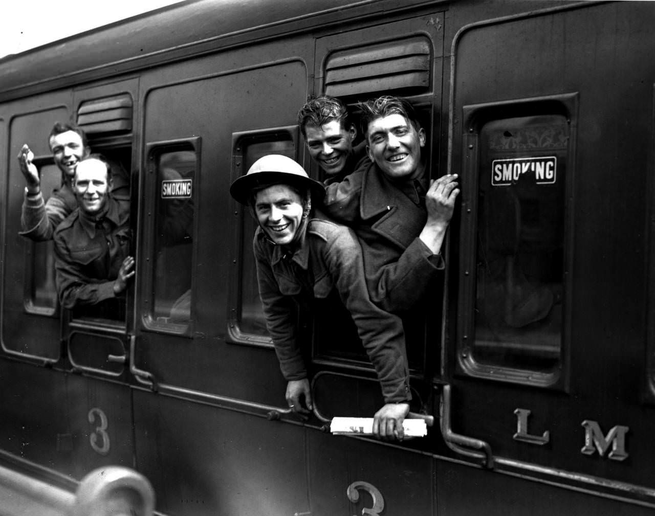 #14 Members of the British forces arrive home by train after being evacuated from Dunkirk, 1940.