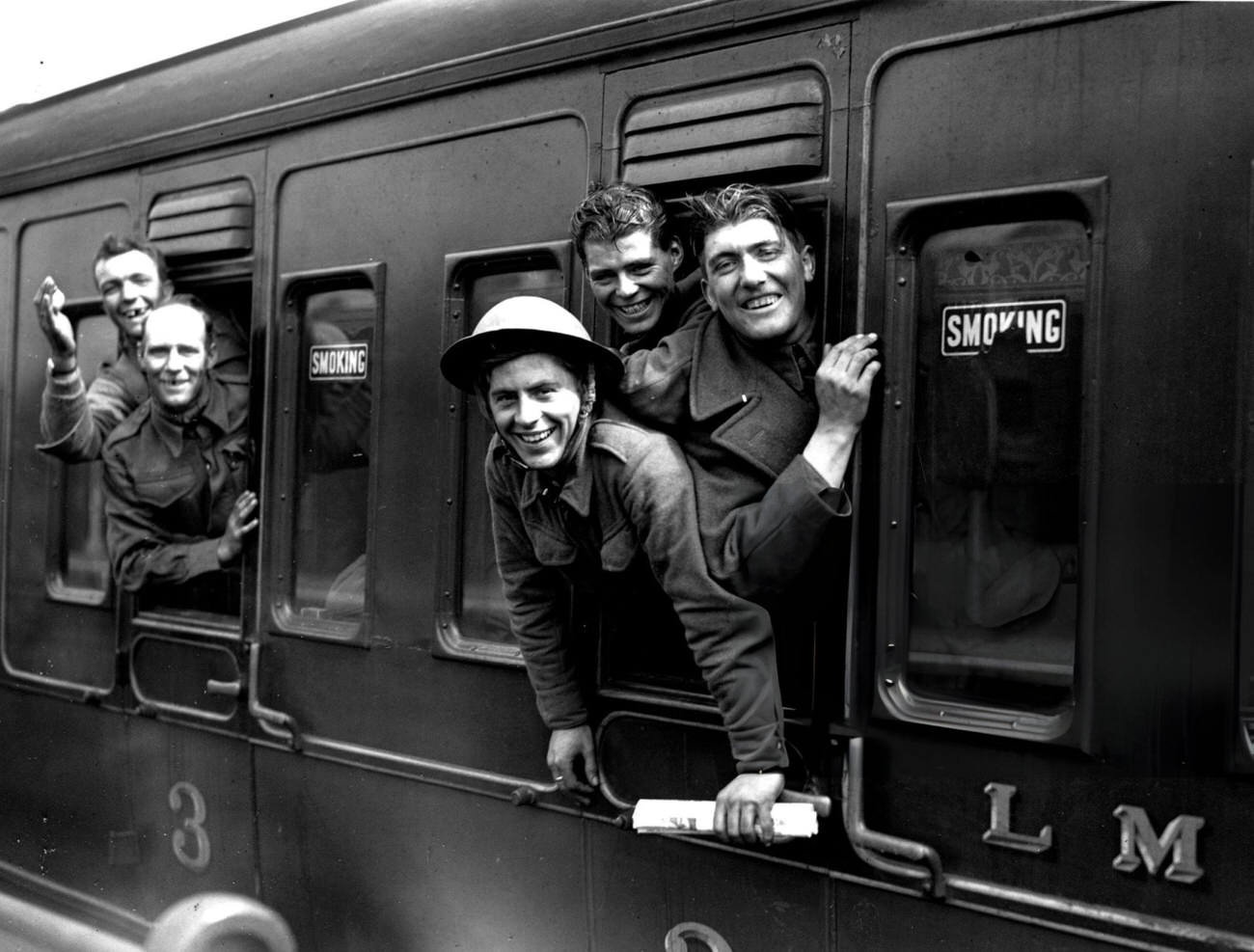 #32 Members of the British forces arrive home by train after being evacuated from Dunkirk, 1940.