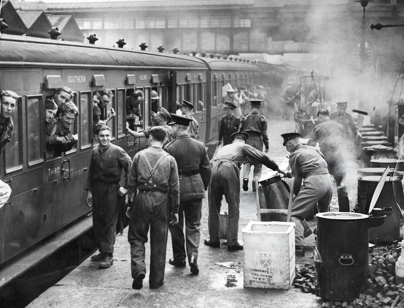 #39 A cook house set up on a London station platform, England, serving hot food to servicemen arriving from northern France, following the evacuation of Allied troops from Dunkirk, 1940.
