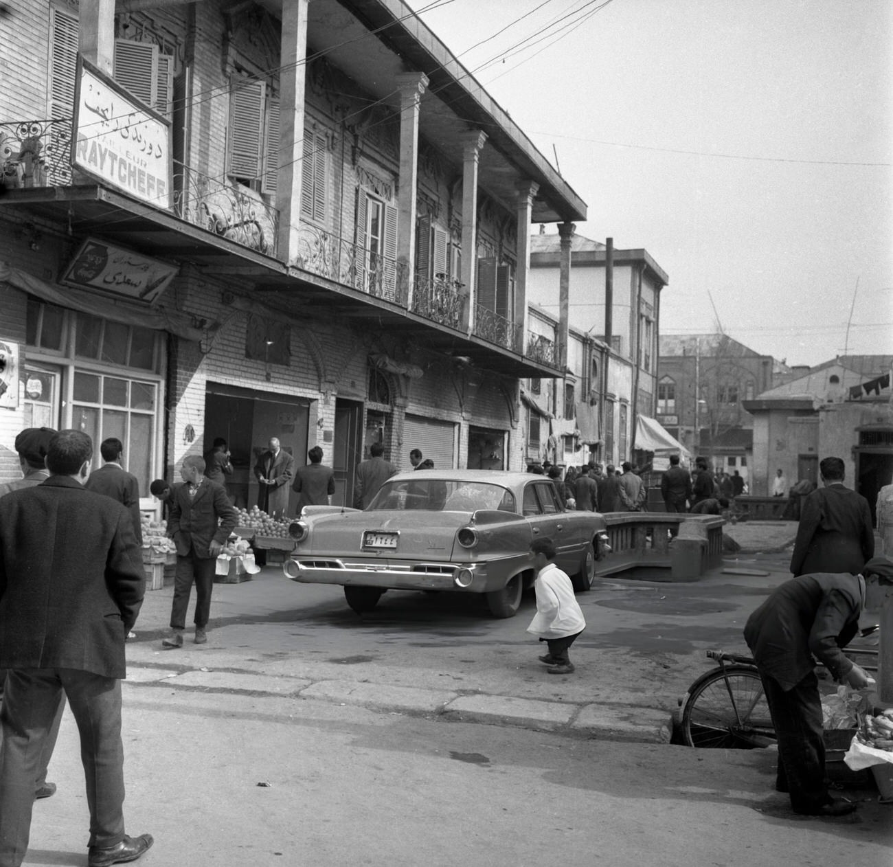#8 A Chevrolet car parked on a street in Tehran, 1964.