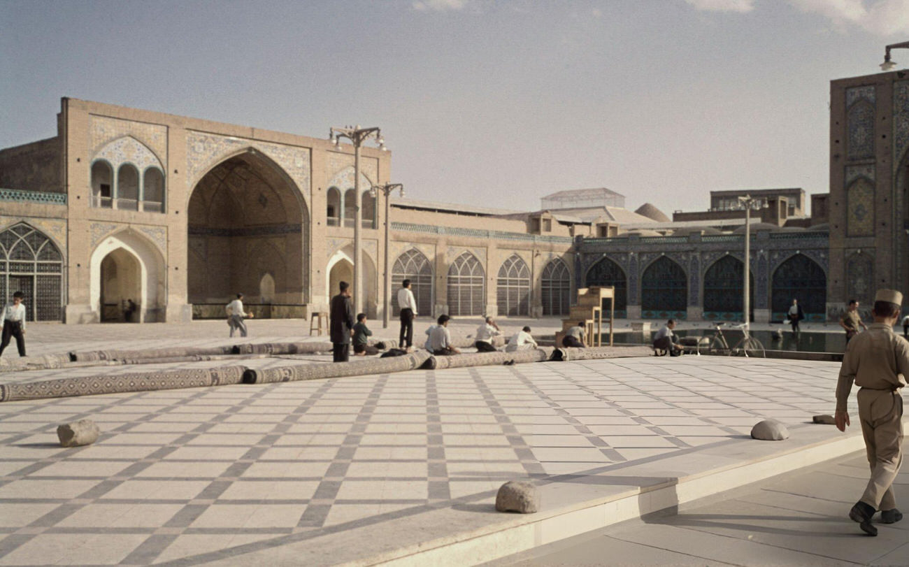 #45 Muslim men prepare to pray in the courtyard of the Shah Mosque in Tehran, 1967.