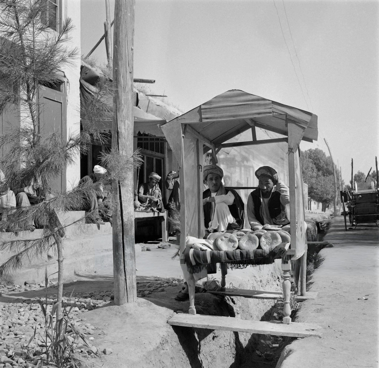 #39 Iranian men sell bread in a street of Tehran, 1968.