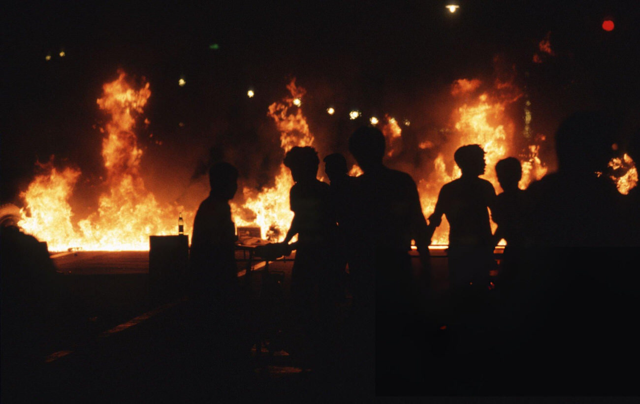 #40 Buses and vehicles burn and pro-democracy demonstrators retreat down Chang’an Avenue, 1989.