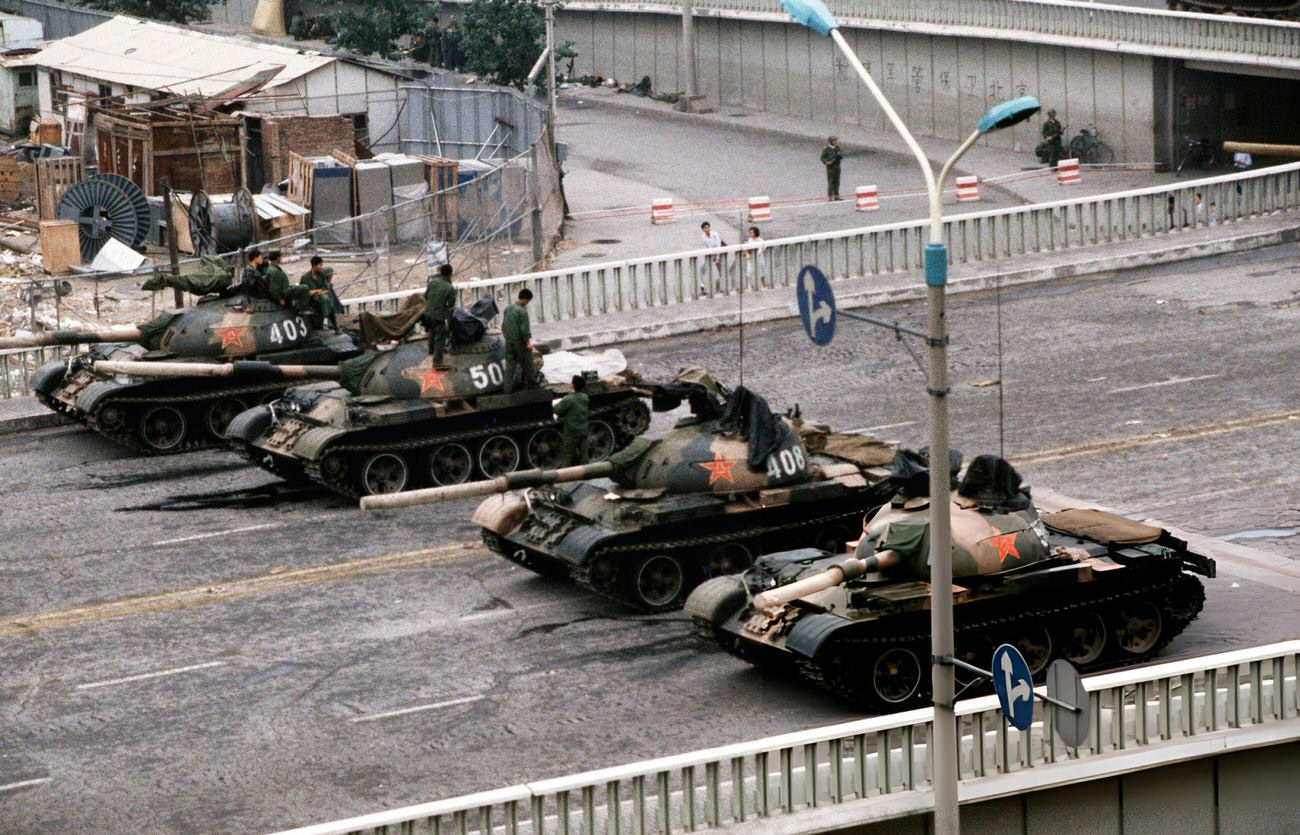 #51 Chinese Army tanks block an overpass on Changan Avenue leading to Tiananmen Square, 1989.