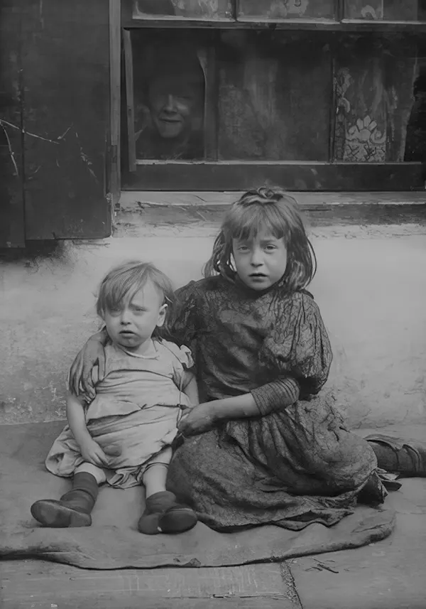 #5 Two children in Spitalfields, one of the worst slums in London. 1903.