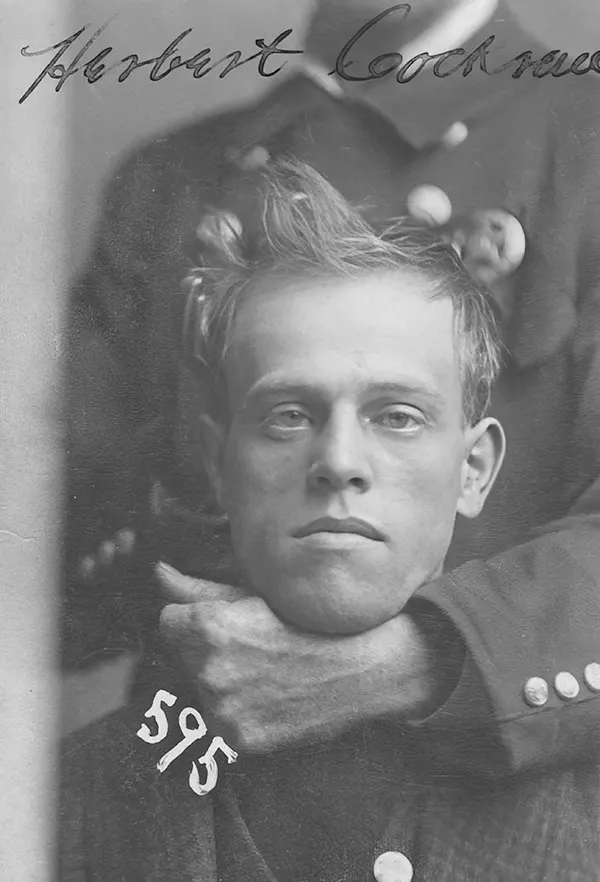 #12 An unidentified member of the Omaha police force holds Herbert Cockran in a headlock during his mugshot in November 1899. Cockran was arrested on burglary charges.