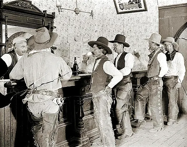 #1 Cowboys enjoy drinks at the Equity Bar in Old Tascosa, Texas, 1907.