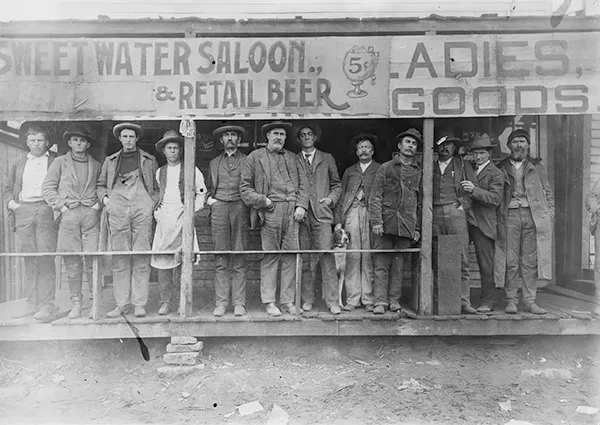 #2 Men gather outside the Sweetwater Saloon in Texas.