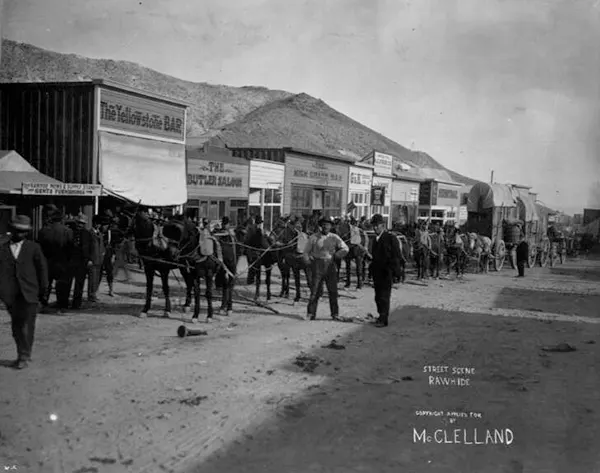 #22 Saloons and wagons line the streets of this frontier town.